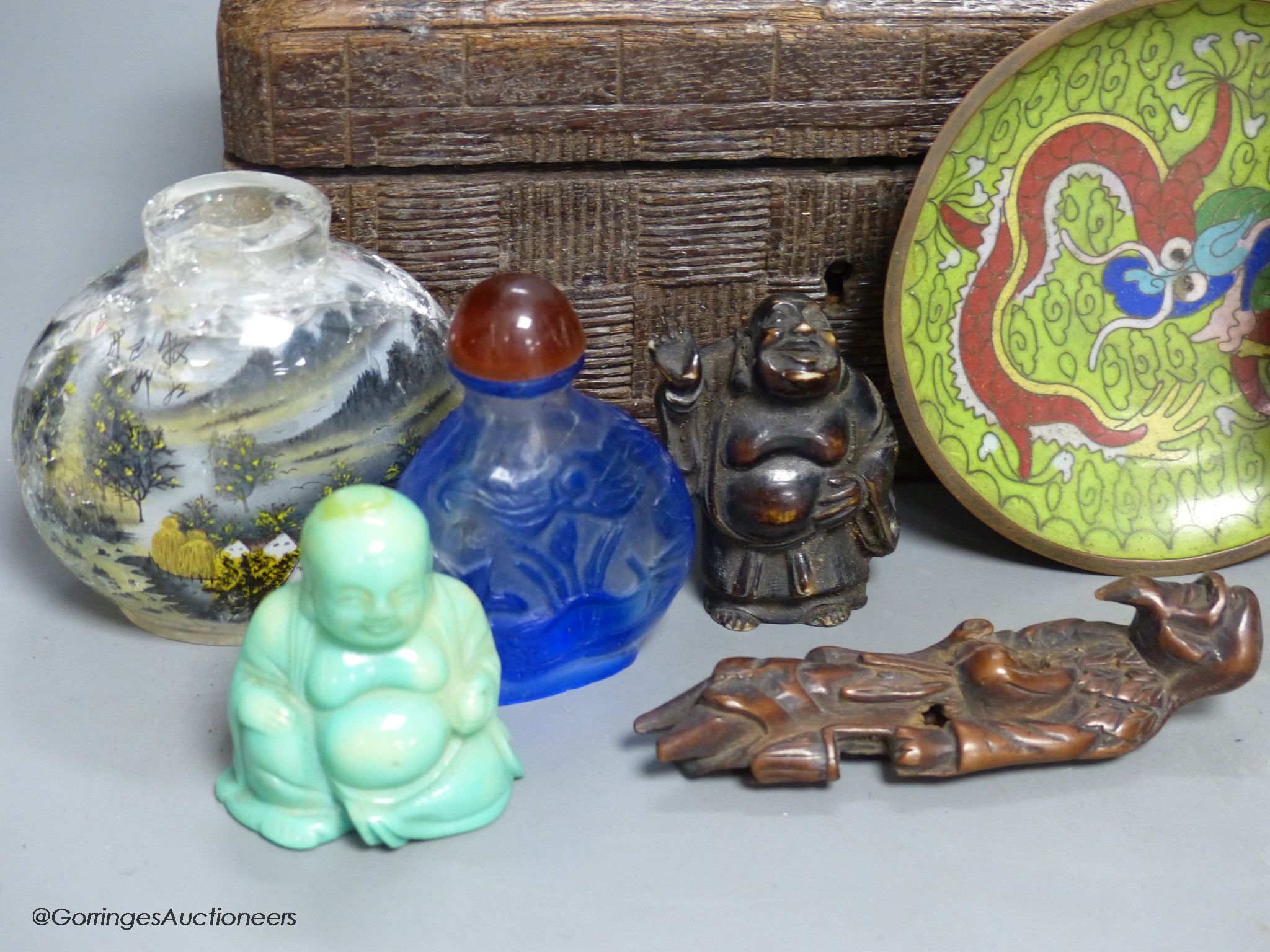 A small miscellaneous Oriental collection including enamel snuff boxes, Buddha carvings etc.